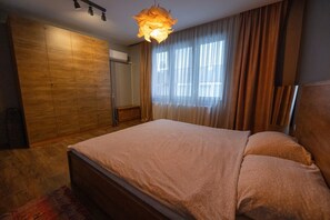 1 غرفة نوم ومكواة/لوح كي وواي فاي وملاءات أسرّة