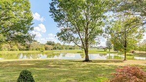 A serene park with a pond, trees, and a well-maintained lawn. - Fish, Unplug & Unwind! Countryside Plymouth Home (Plymouth)
