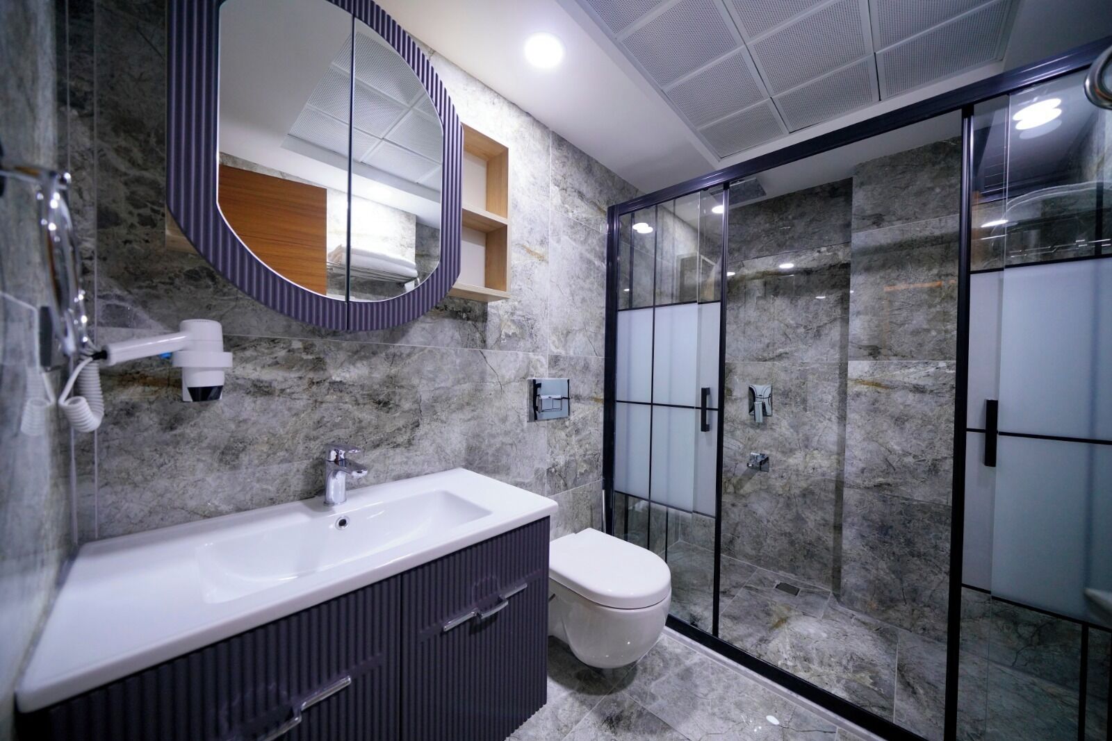 Shower, hair dryer, slippers, towels