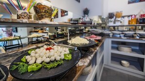 A buffet setup with various food items and utensils on display. - newlifecappadocia (Nevşehir)