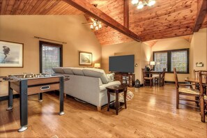 Smart TV, DVD player, foosball, books