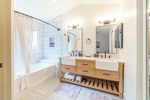 Shower, hair dryer, towels, shampoo