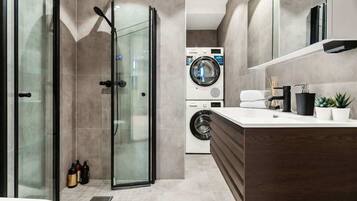 Shower, hair dryer, towels, shampoo