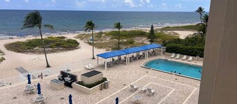 Ocean-Beach Front condo with pool-gym-sauna. Short walk to shops, eats and bars.