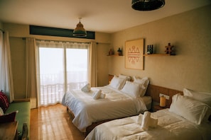 Deluxe Triple Room, Balcony, Sea View | Desk, laptop workspace, free WiFi