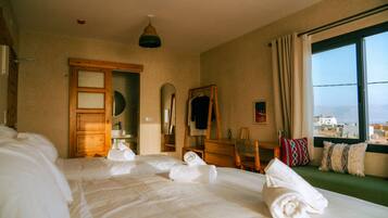 Deluxe Suite, Private Bathroom, Sea View | Desk, laptop workspace, free WiFi