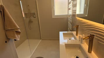 Shower, hair dryer, towels, soap