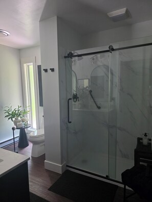 Shower, hair dryer, towels, soap