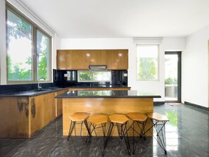 Villa, 4 Bedrooms | Shared kitchen | Microwave, oven, stovetop, cookware/dishes/utensils