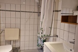 Shower, hair dryer, towels, toilet paper