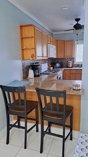 Coffee/tea maker, fridge, microwave, oven
