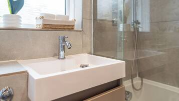 Hair dryer, towels, soap, toilet paper