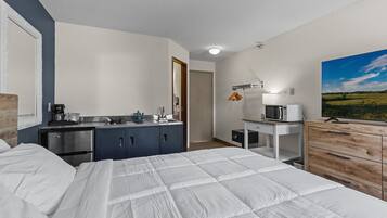 1 bedroom, desk, iron/ironing board, travel crib