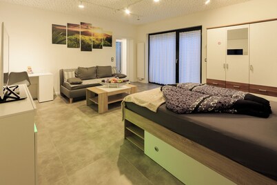 “Saturn” Apartment – 55 m², quiet, free gym & parking