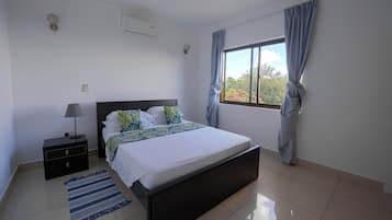 Apartment, Balcony, Ocean View | In-room safe, laptop workspace, iron/ironing board, free WiFi