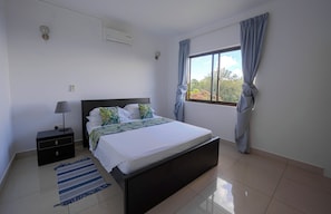 Apartment, Balcony, Ocean View | In-room safe, laptop workspace, iron/ironing board, free WiFi