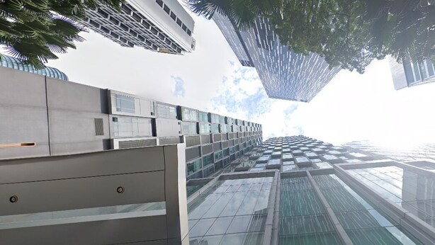A modern building with a glass facade and a series of balconies. - SOHO Suites KLCC by noon (Kuala Lumpur)