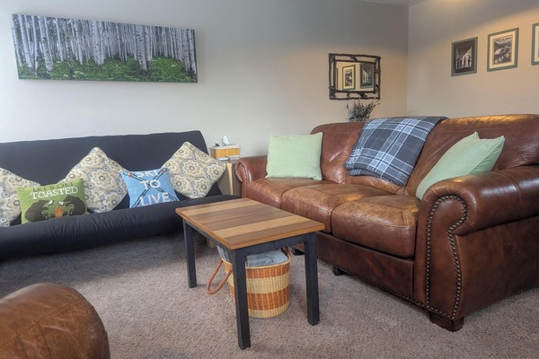 Open concept living room with wood burning fireplace