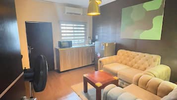 Standard Apartment, 1 Bedroom | Living area | 36-inch LED TV with cable channels