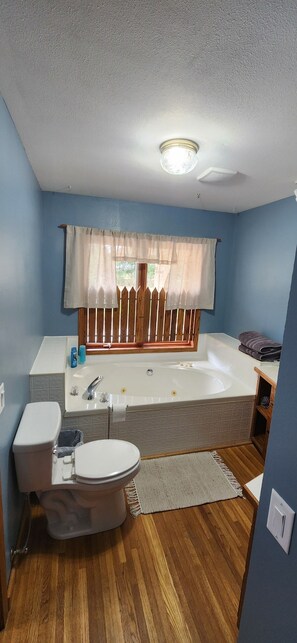 Shower, jetted bath, towels, soap