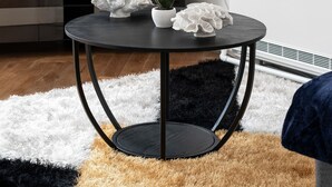 A modern living room with a round black table, white flowers, and a TV displaying "NETFLIX". - Stylish 2 Bed Apartment Central Brighton, The Lanes Sleeps 8 (Brighton and Hove)