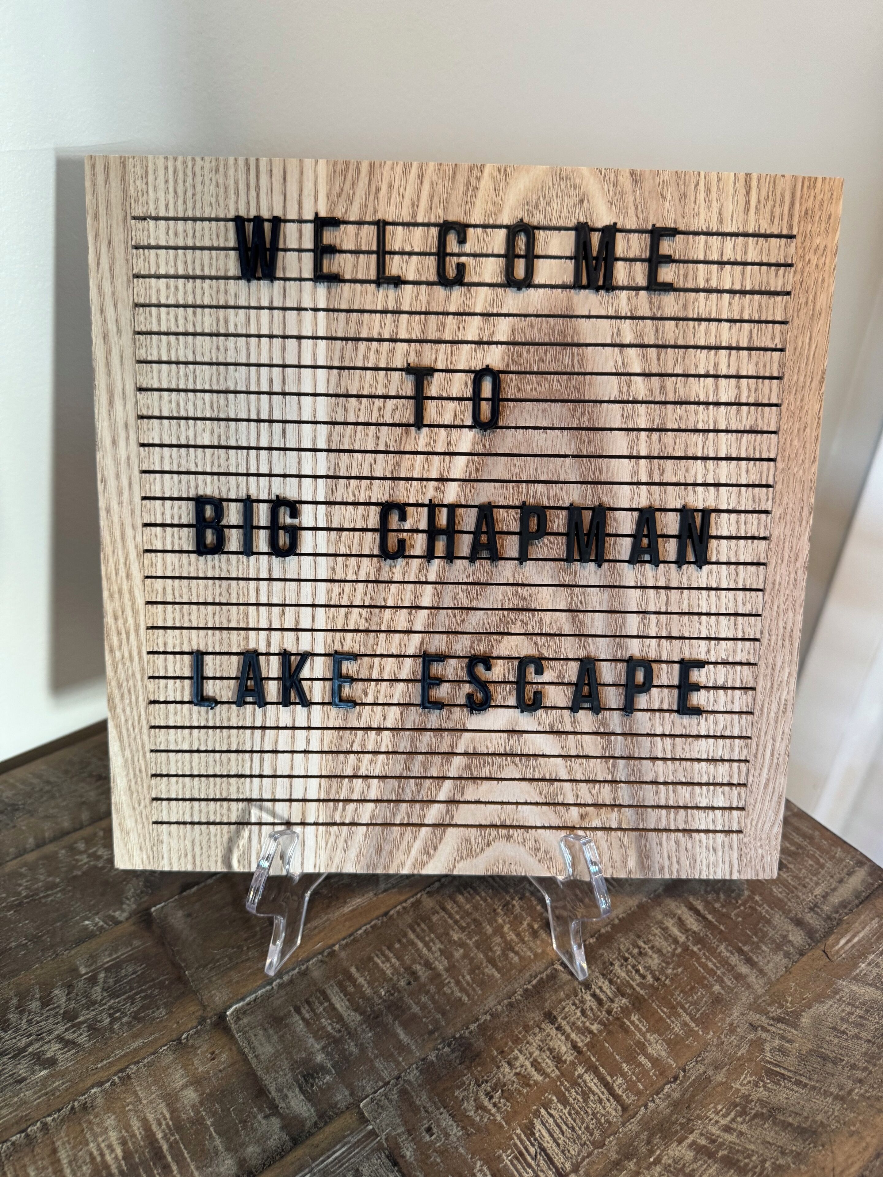A welcome sign with the text "WELCOME TO BIG CHAPMAN LAKE ESCAPE".