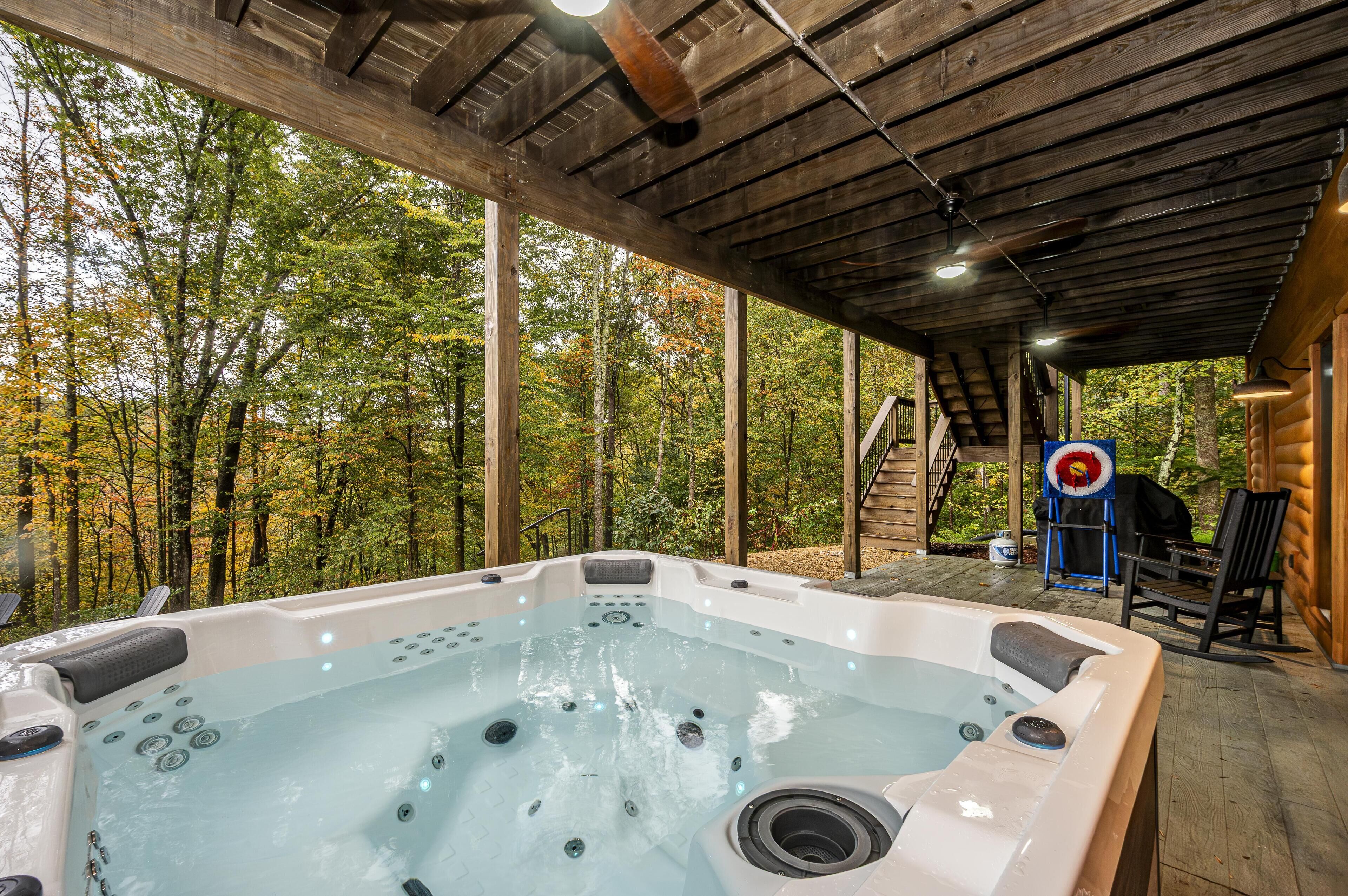 Secluded covered patio with a relaxing hot tub retreat
