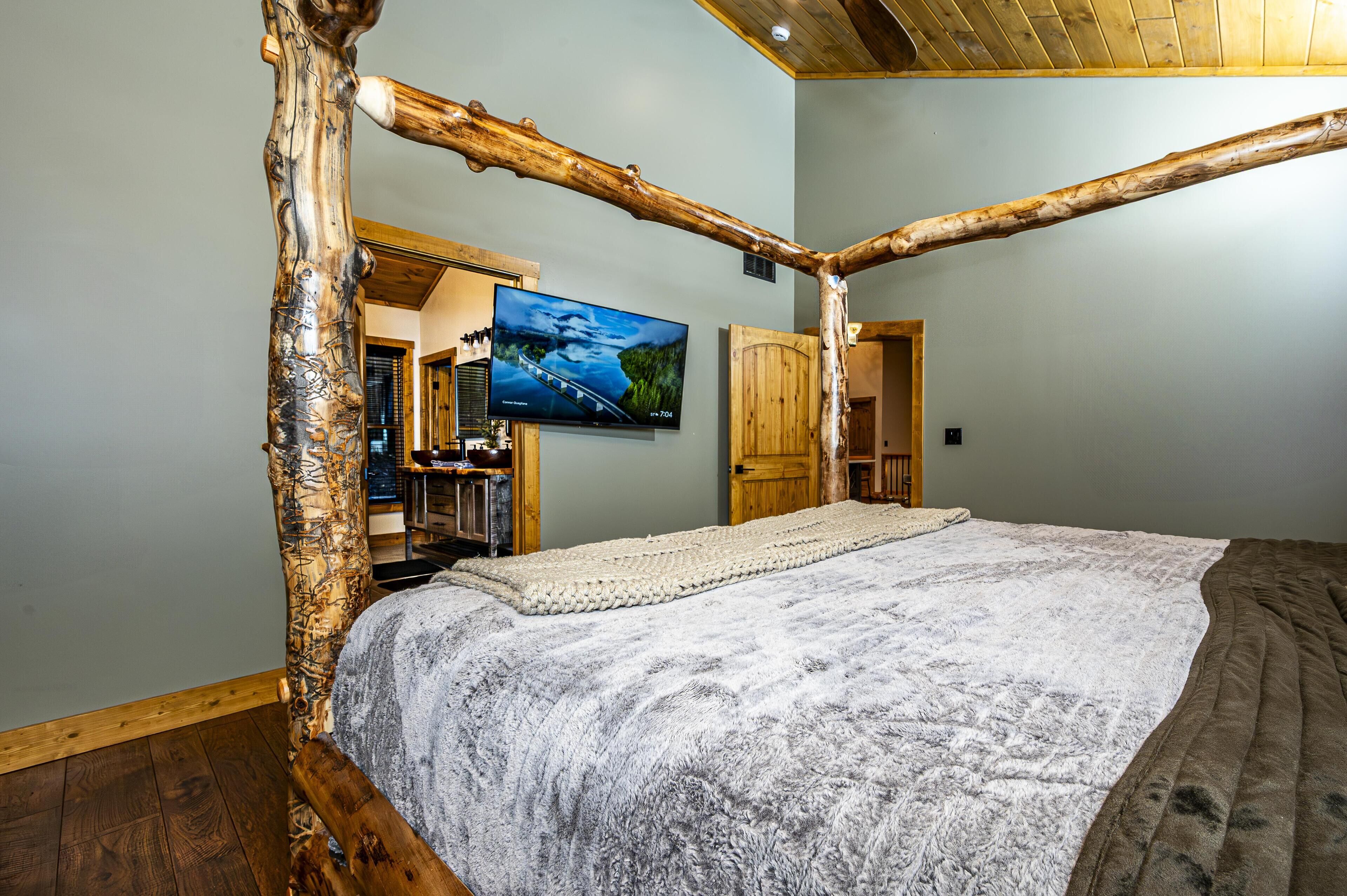 Rustic bedroom retreat with handcrafted log bed and cozy ambiance