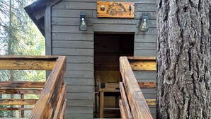 A wooden staircase leading to a cabin with a sign that reads "Smoke's Treehouse". - One acre with a fire pit, kids play area, treehouse, zipline, pets welcome (Springville)