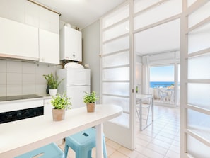 Fridge, microwave, cookware/dishes/utensils