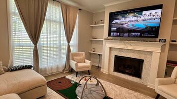 Smart TV, fireplace, table tennis, books