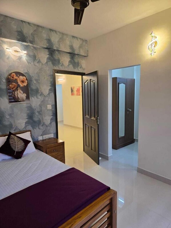 Executive Suite, 3 Bedrooms, Balcony, City View | Blackout curtains, soundproofing, iron/ironing board, free WiFi