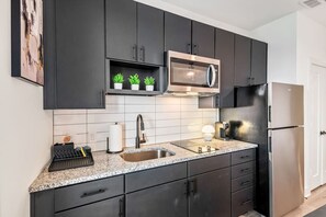Fridge, microwave, stovetop, coffee/tea maker