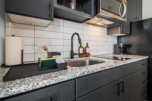 Fridge, microwave, stovetop, coffee/tea maker