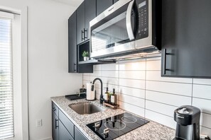 Fridge, microwave, stovetop, coffee/tea maker