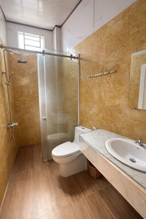 Superior Quadruple Room | Bathroom | Shower, rainfall showerhead, designer toiletries, slippers