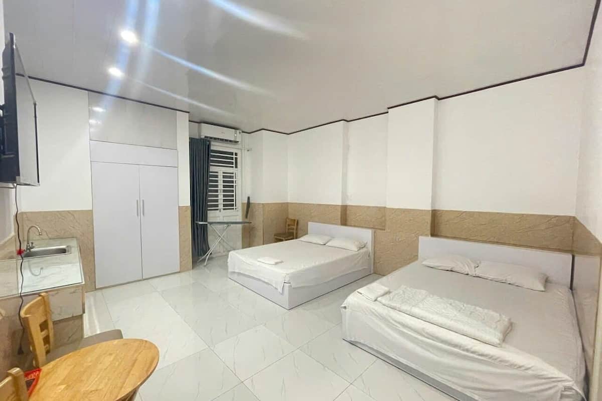 Executive Quadruple Room | In-room safe, desk, laptop workspace, blackout drapes
