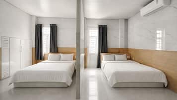 Superior Quadruple Room | In-room safe, desk, laptop workspace, blackout drapes