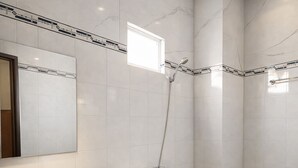 A modern bathroom with a marble vanity, a toilet, and a shower. - CKC 24H Hotel Near Can Tho City Center (Can Tho)