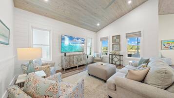 Signature House, 4 Bedrooms, Balcony, Garden View | Living room | 50-inch Smart TV with digital channels