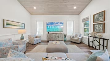 Signature House, 4 Bedrooms, Balcony, Garden View | Living room | 50-inch Smart TV with digital channels