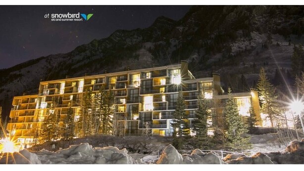 A multi-story hotel with a modern design, featuring balconies and large windows, set against a mountainous backdrop. - Ski-in-ski-out Snowbird, X-large studio, Alta, LCC Hot Tub, Heated Pool (Snowbird)