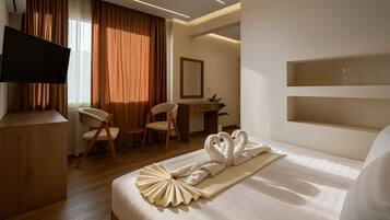 Egyptian cotton sheets, premium bedding, minibar, desk