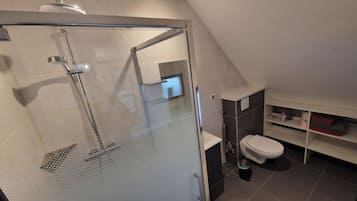 Shower, hair dryer, towels, toilet paper
