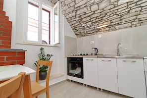 Fridge, oven, stovetop, dining tables