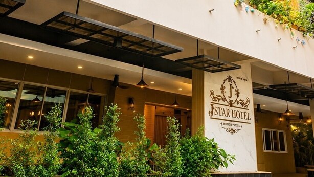 A hotel with a sign reading 'STAR HOTEL,' balconies with plants, and a modern architectural style. - Large Studio with Kitchen – 50m from Jomtien Beach (Muang Pattaya)