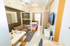 Comfort Studio, Balcony, Garden View | Living area | 43-inch Smart TV with digital channels, foosball - Modern Retreat with Private Balcony (Lapu-Lapu)