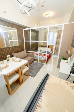 Comfort Studio, Balcony, Garden View | Living area | 43-inch Smart TV with digital channels, foosball - Modern Retreat with Private Balcony (Lapu-Lapu)