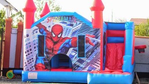 A Spider-Man themed inflatable play area with a slide and a tunnel. - Pennjoki Resort (Kakamega)