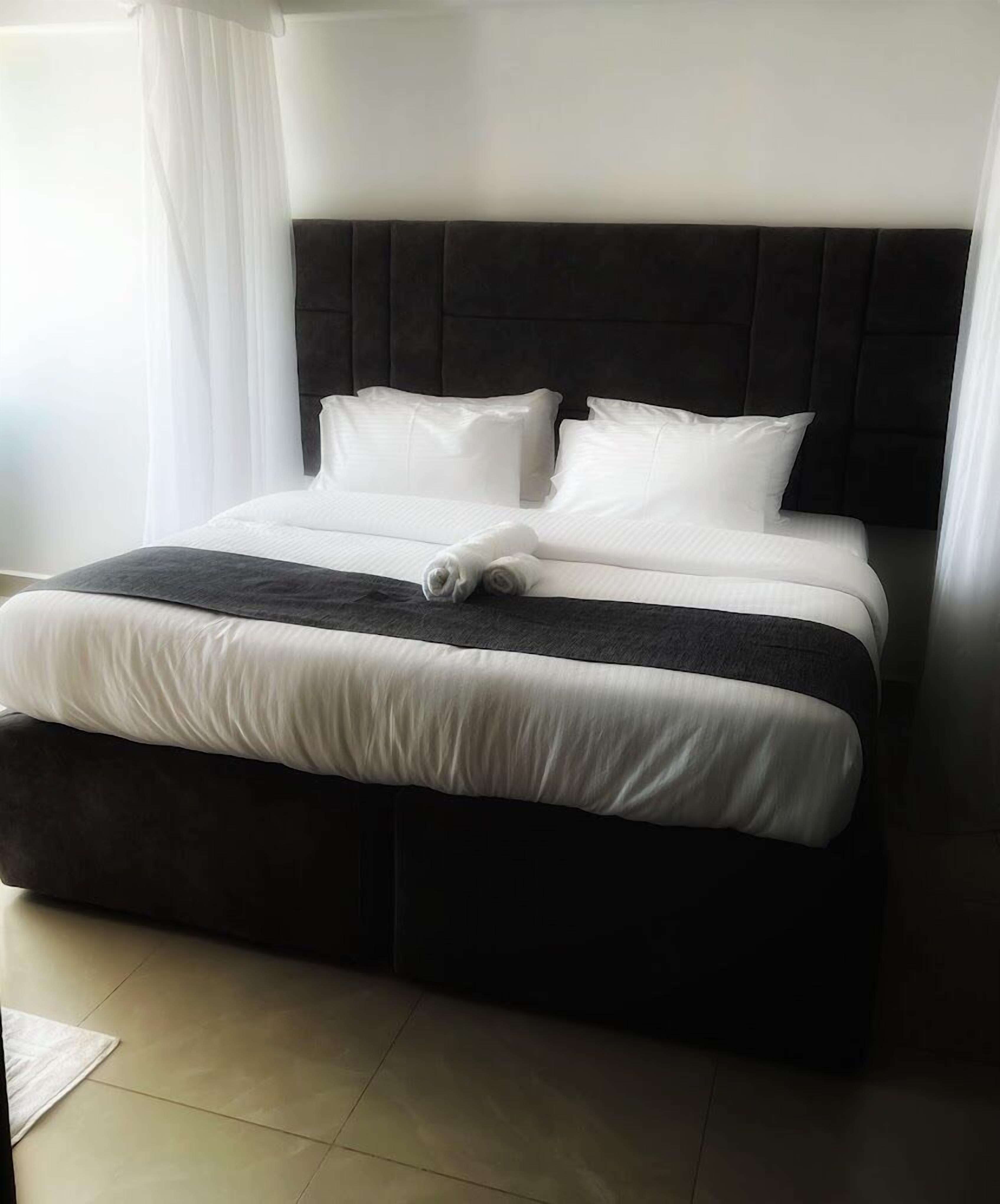 デラックス ダブルルーム シティビュー | WiFi (無料)、ベッドシーツ